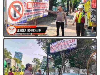 Tingkatkan Kamseltibcarlantas, Polres Pelabuhan Tanjung Perak Pasang Banner Larangan Parkir di Jalan Perak Barat